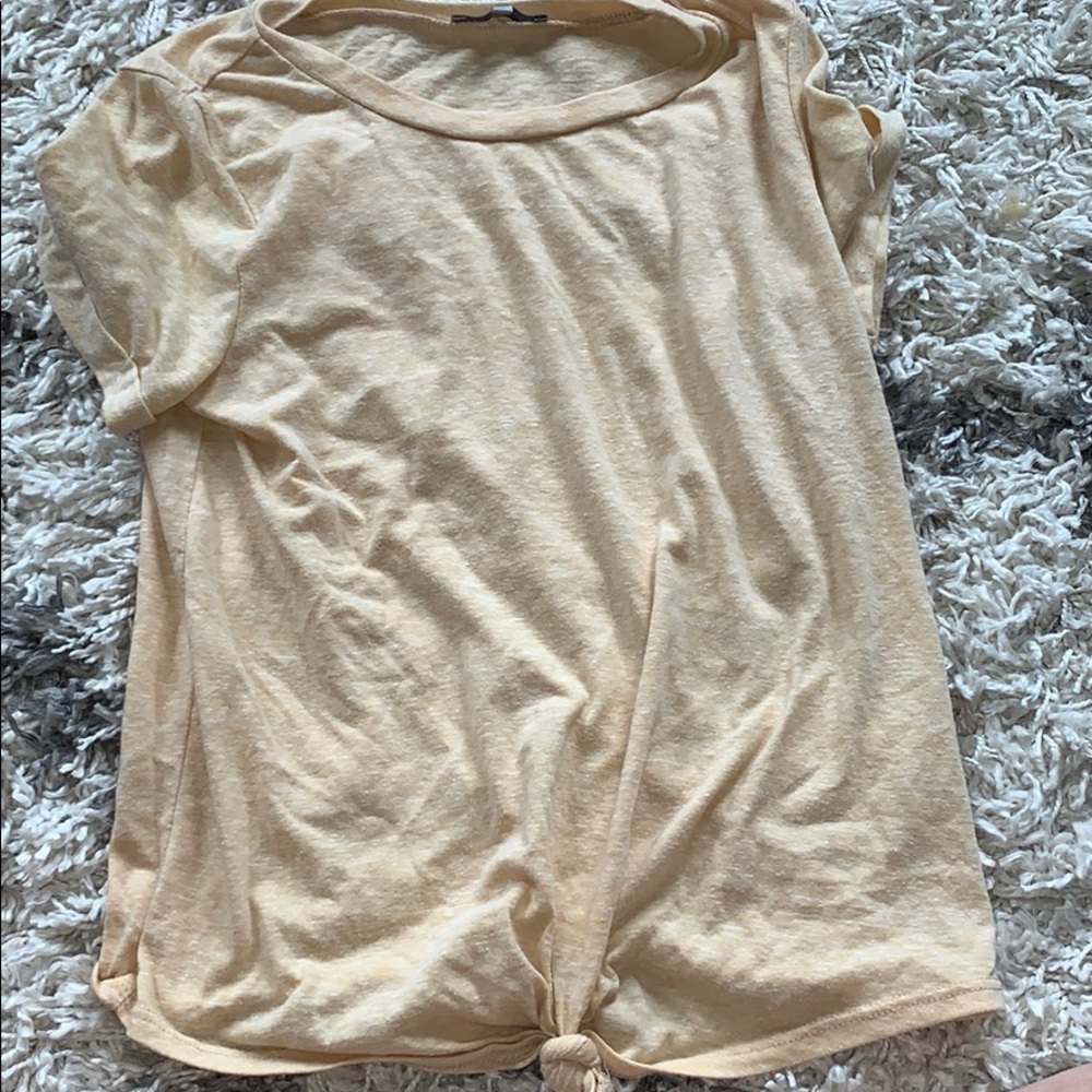 Yellow shirt with a tie in front